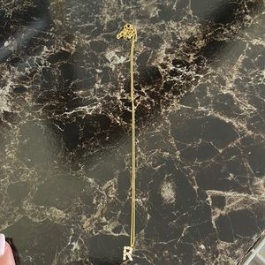 Gold pearl with an initial R necklace
